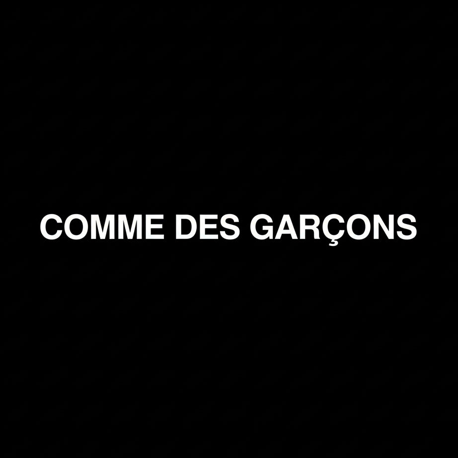 Comme des Garçons wordmark in white on black square background, monochrome Japanese fashion house banner