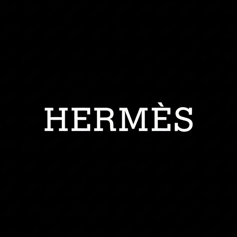 Hermès wordmark in white on black square background, monochrome French luxury house banner
