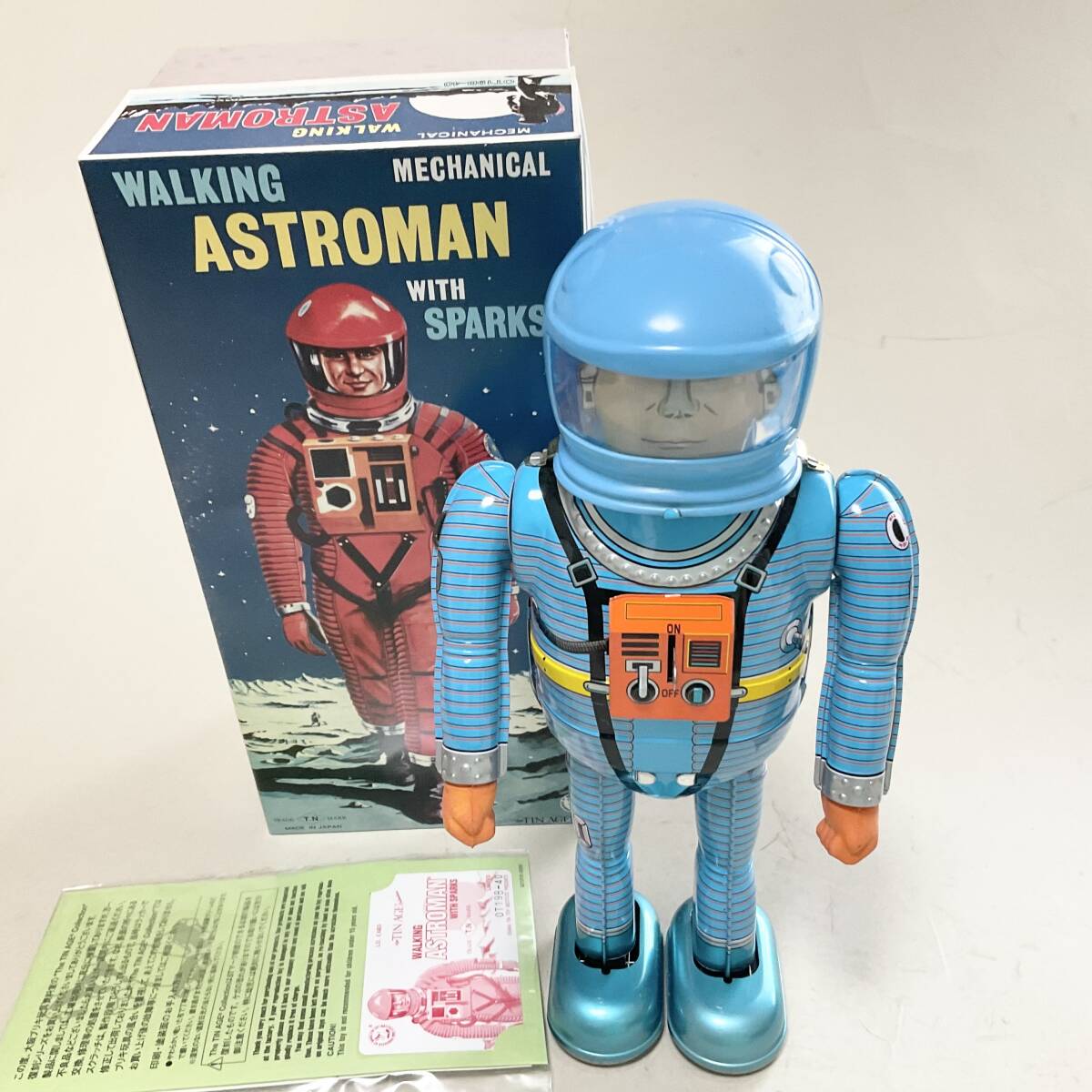 Astroman Blue Walking Mechanical Tin Robot with Sparks Boxed with Papers Space Age Vintage-Style Collectible