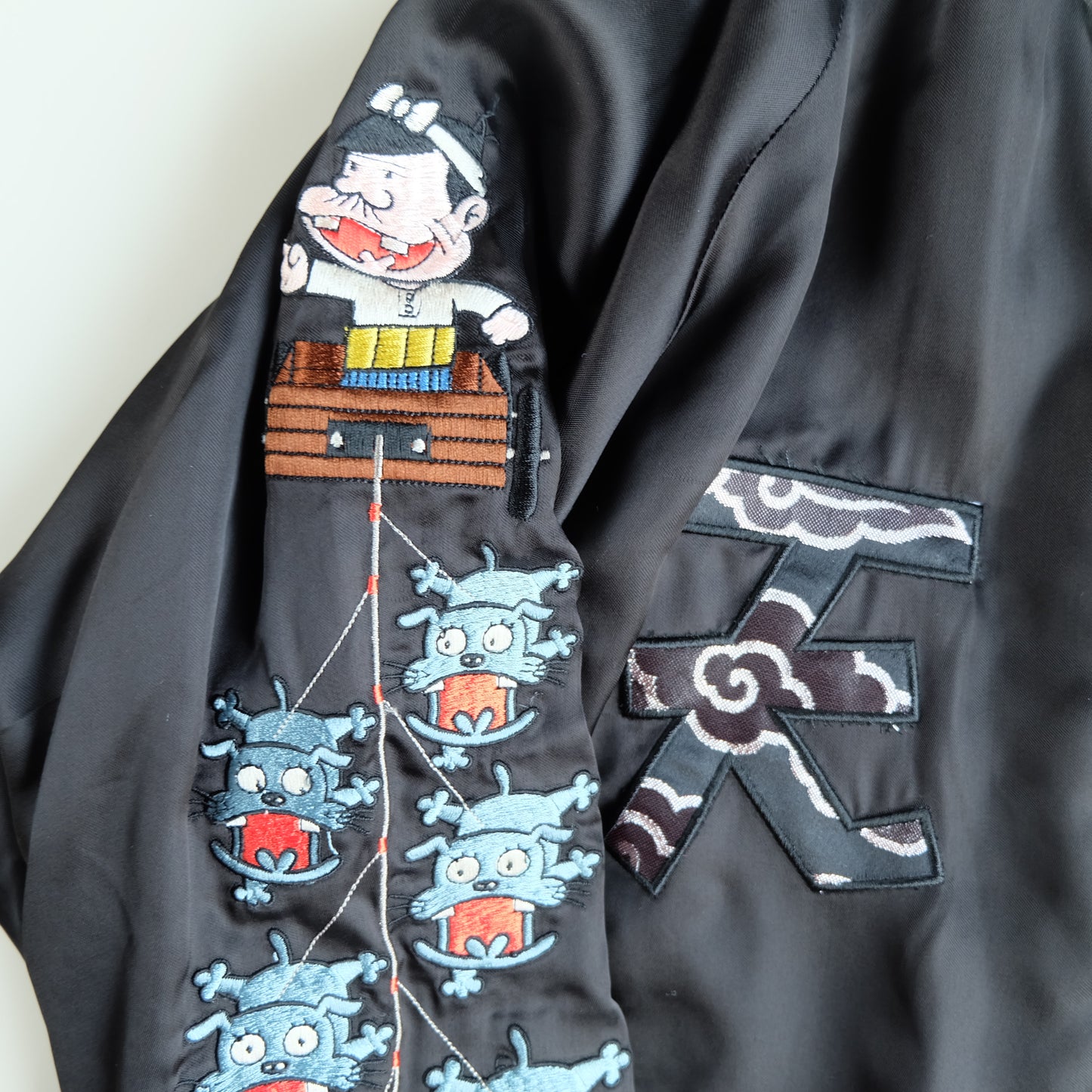 The Iconic Juvenile Delinquent x Tensai Bakabon Sukajan Jacket Reversible Korede Iinoda Embroidered Anime Souvenir Bomber Black Ivory