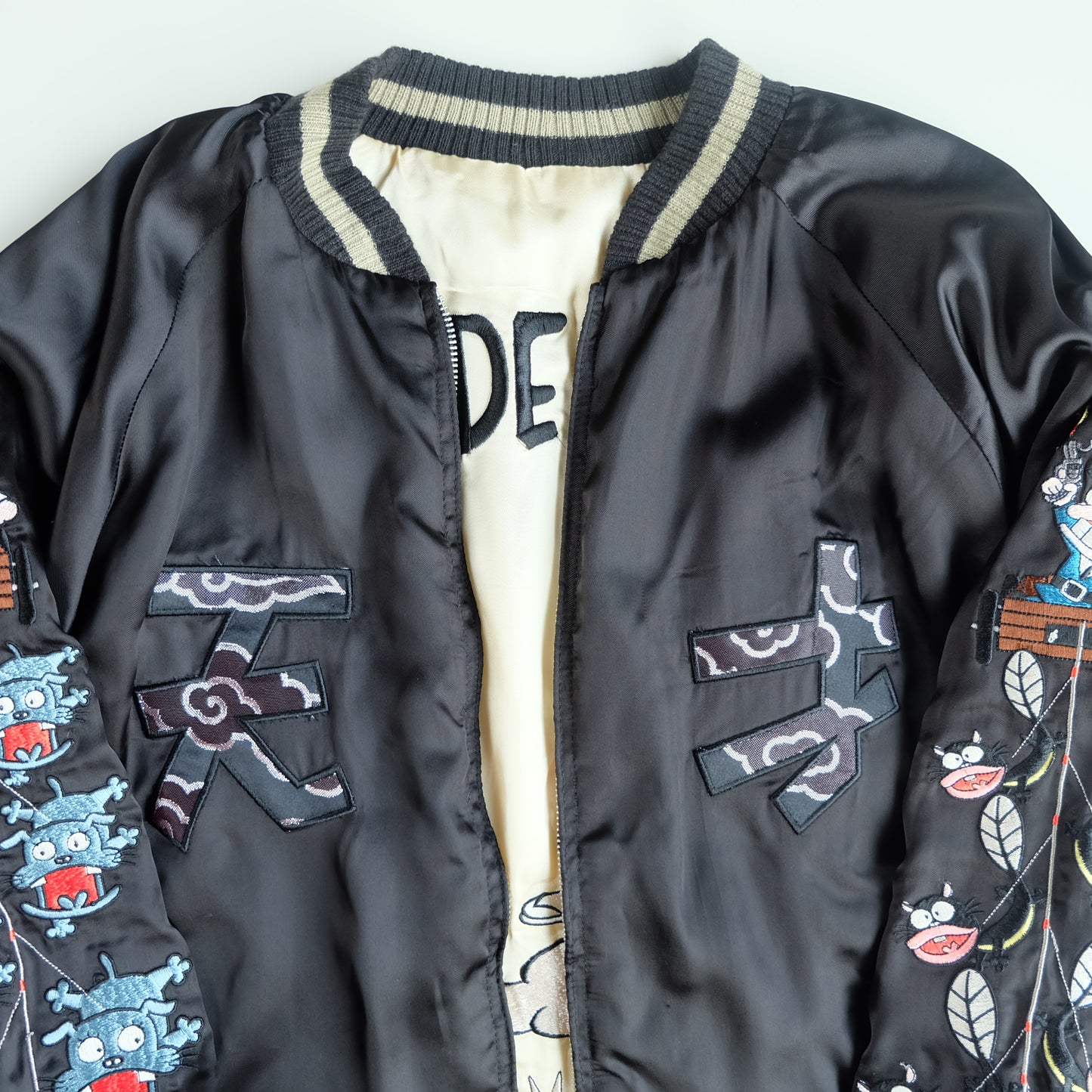 The Iconic Juvenile Delinquent x Tensai Bakabon Sukajan Jacket Reversible Korede Iinoda Embroidered Anime Souvenir Bomber Black Ivory
