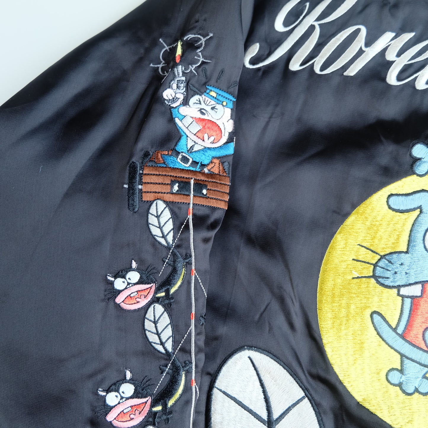The Iconic Juvenile Delinquent x Tensai Bakabon Sukajan Jacket Reversible Korede Iinoda Embroidered Anime Souvenir Bomber Black Ivory