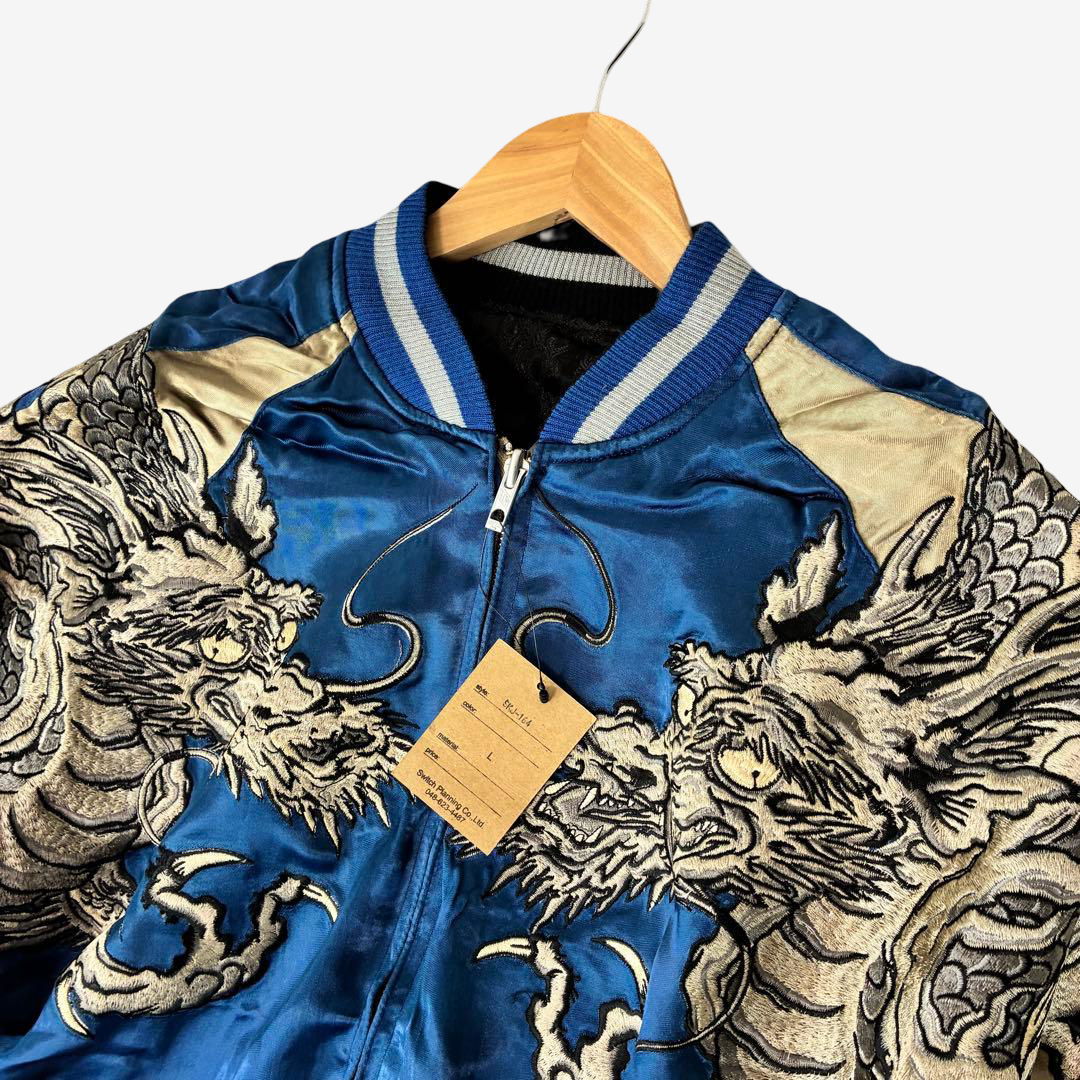 Rare blue and gold reversible Sukajan jacket featuring full-wrap twin dragon embroidery. Vintage Hanatabi Gakudan school souvenir with original tags.