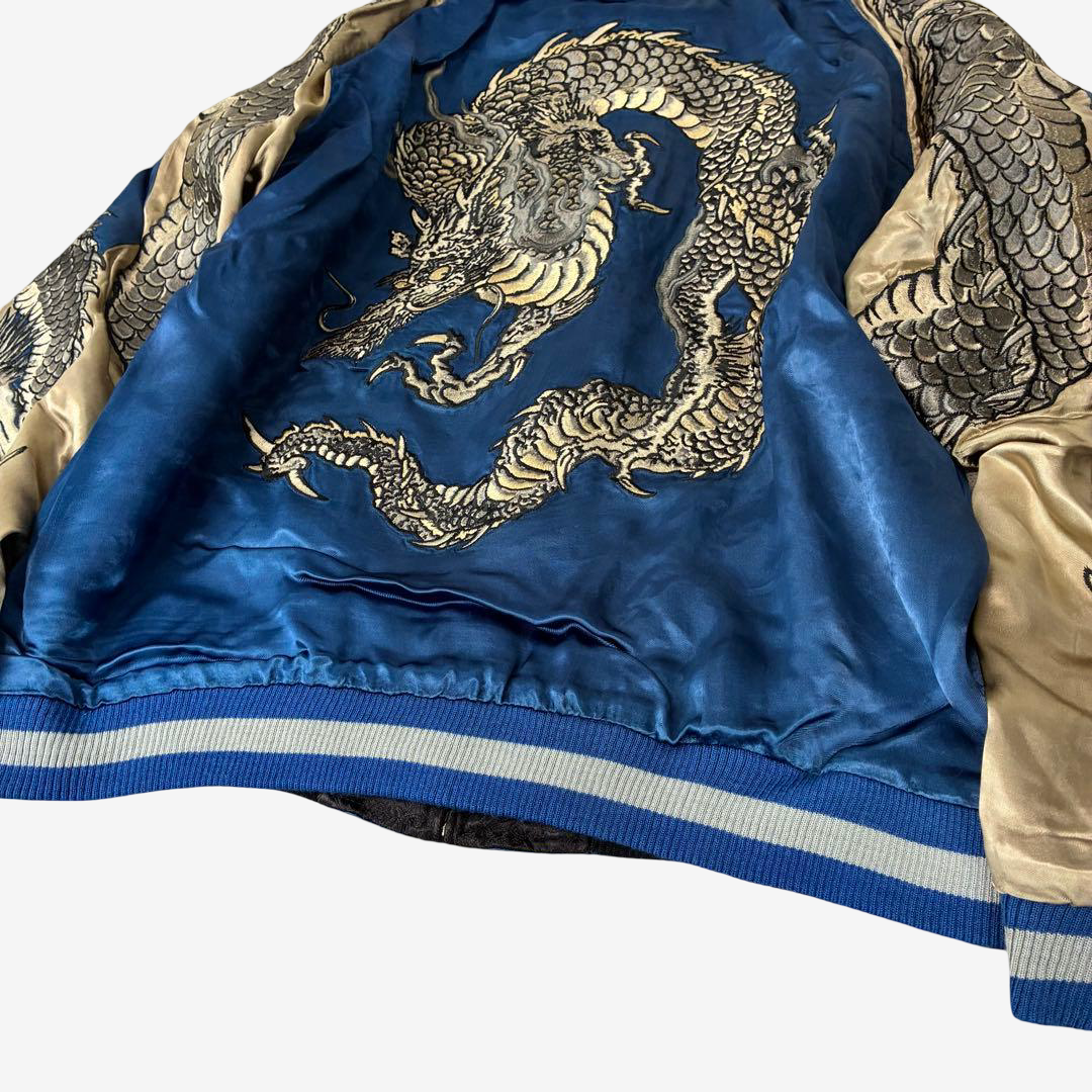 Blue and champagne gold rayon suzuran jacket with intricate twin dragon embroidery, reversible design, and ribbed cuffs.Rare Hanatabi Gakudan SCRIPT Dragon Sukajan in blue and gold with full-wrap twin dragon embroidery.