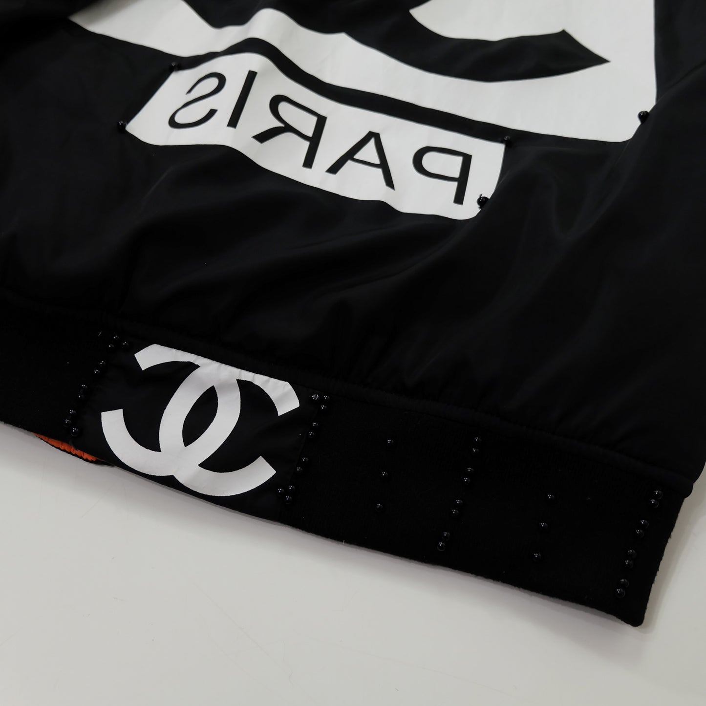 CHANEL Rue Paris Big Logo Black Bomber Jacket | Orange Quilted Lining | Size M | Rare 1990s-Style Luxury Streetwear