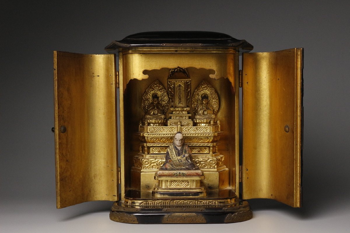 Nichiren Shonin Triad Zushi Shrine — Polychrome Wooden Founder Icon with Gilt Interior Miniature Altar, Fine Metal Fittings and Aged Black Lacquer Case (Approx. 23.5 cm Tall)