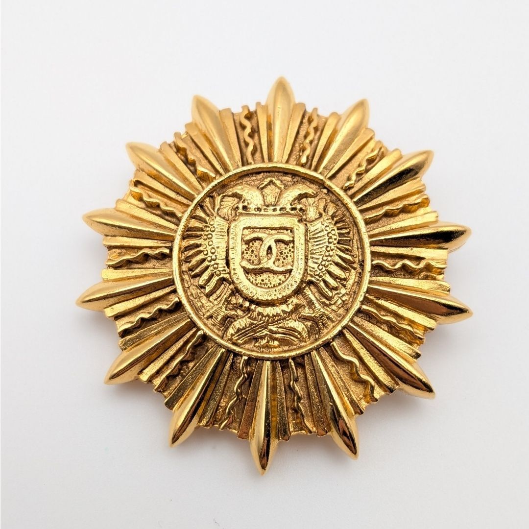 Chanel Sunburst Emblem Brooch with Crest, Gilt Metal, Early Vintage, view 1