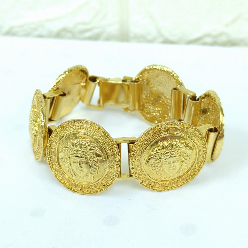 Gianni Versace 1990s Six-Medallion Medusa Coin Bracelet with Greek Key Borders, Gold Tone, Made in Italy, view 1