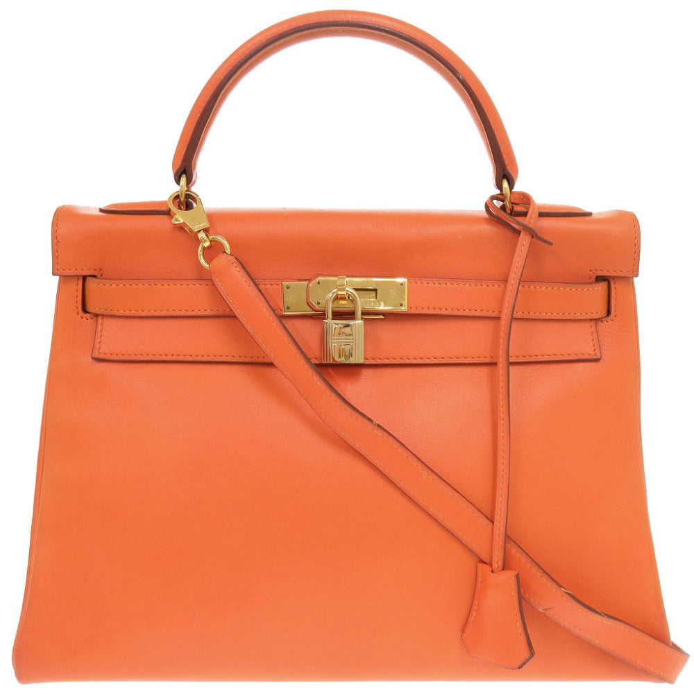 Hermès Kelly 32 Retourne, Orange Vache Gulliver, Gold Hardware, 1996, Full Set, view 1
