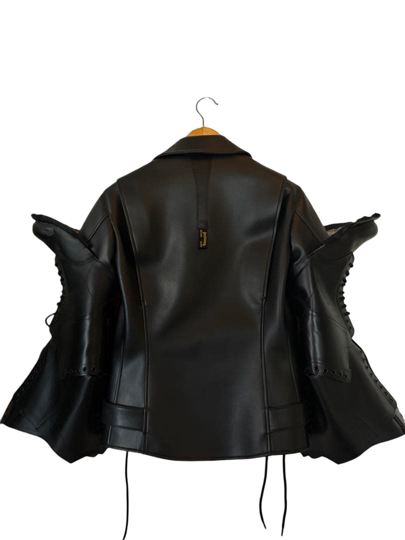 Junya Watanabe × Dr. Martens faux leather rider jacket JP-J102, black – back view with lace-up boot sleeves