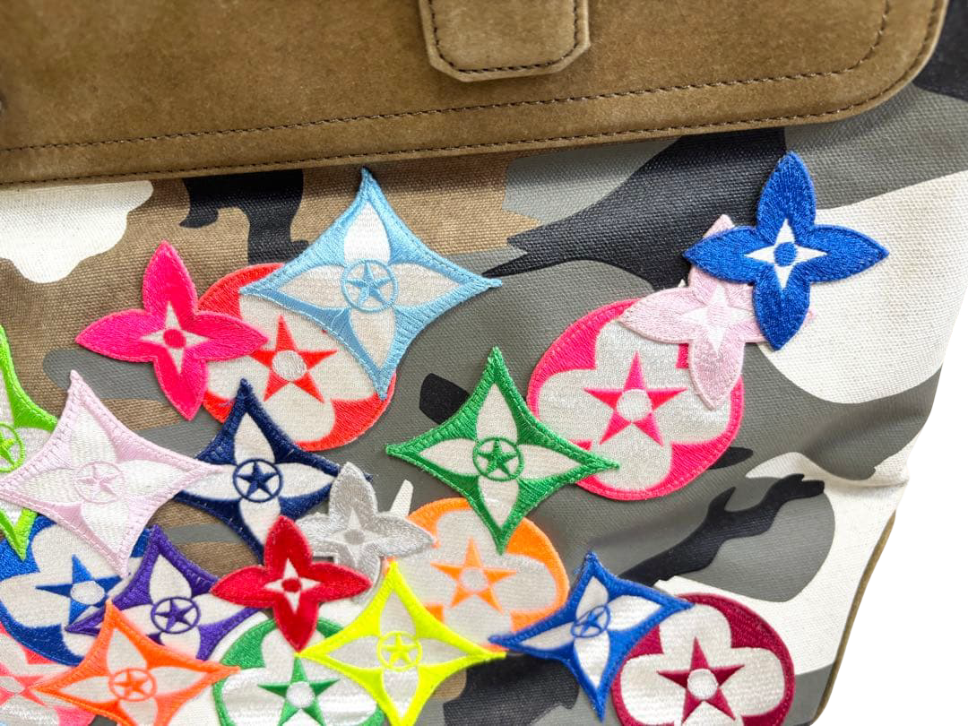 READYMADE Gym Bag camouflage canvas tote with multicolour flower patches – flower patch cluster detail, left side