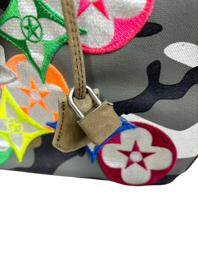 READYMADE Gym Bag camouflage canvas tote with multicolour flower patches – zip pull and leather tab beside the patches